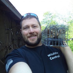 Randy from Maine Wildlife Management taking a quick selfie with the last remaining baby red squirrels before reuniting with their mother